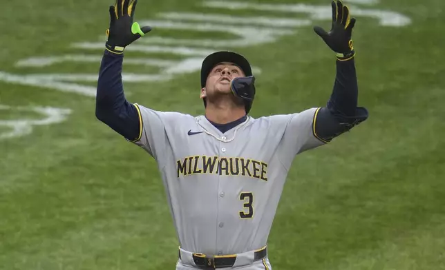 Milwaukee Brewers' Joey Ortiz celebrates as he crosses home plate after hitting a solo home run off Pittsburgh Pirates pitcher Mike Burrows during the second inning of a baseball game in Pittsburgh, Thursday, May 22, 2025. (AP Photo/Gene J. Puskar)