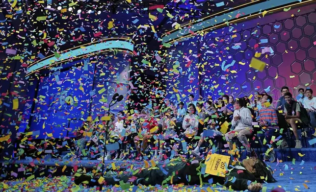 Faizan Zaki, 13, of Dallas, lays on the stage as confetti drops around him after he won the 2025 Scripps National Spelling Bee at the Gaylord National Resort &amp; Convention Center Thursday, May 29, 2025, in Oxon Hill, Md. (AP Photo/Jose Luis Magana)