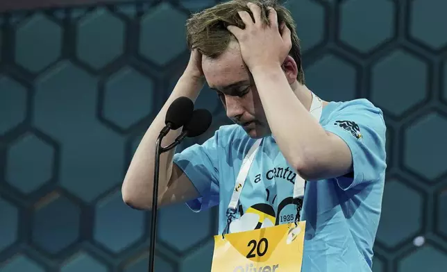Oliver Halkett, 13, of Los Angeles, reacts after spelling his word incorrectly in the finals of the Scripps National Spelling Bee, Thursday, May 29, 2025, in Oxon Hill, Md. (AP Photo/Jose Luis Magana)