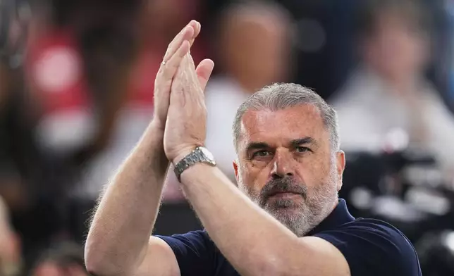 Tottenham's head coach Ange Postecoglou applauds ahead of the Europa League final soccer match between Tottenham Hotspur and Manchester United at the San Mames Stadium in Bilbao, Spain, Wednesday, May 21, 2025. (AP Photo/Manu Fernandez)
