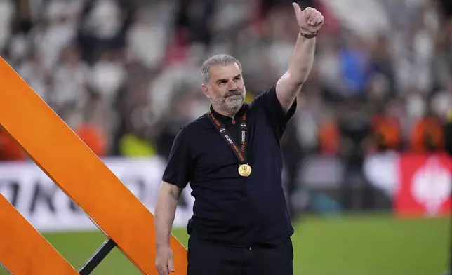Tottenham's head coach Ange Postecoglou applauds fans at the end of the Europa League final soccer match between Tottenham Hotspur and Manchester United at the San Mames Stadium in Bilbao, Spain, Wednesday, May 21, 2025. (AP Photo/Bernat Armangue)