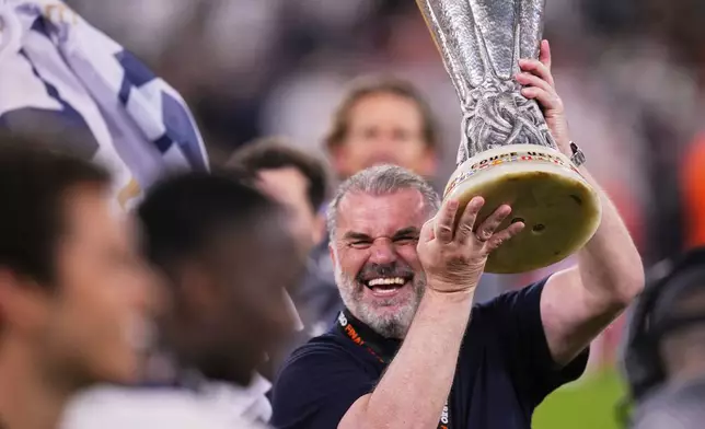 Tottenham's head coach Ange Postecoglou celebrates after winning the Europa League final soccer match against Manchester United at the San Mames Stadium in Bilbao, Spain, Wednesday, May 21, 2025. (AP Photo/Manu Fernandez)