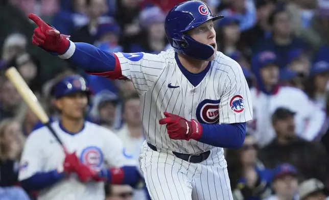 Chicago Cubs' Pete Crow-Armstrong points after hitting a one-run double during the second inning of a baseball game against the Philadelphia Phillies in Chicago, Sunday, April 27, 2025. (AP Photo/Nam Y. Huh)