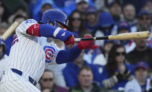 Chicago Cubs' Pete Crow-Armstrong hits a one-run double during the second inning of a baseball game against the Philadelphia Phillies in Chicago, Sunday, April 27, 2025. (AP Photo/Nam Y. Huh)