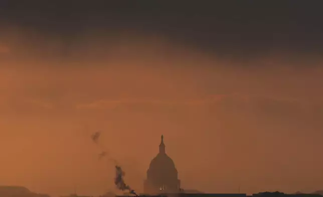 The U.S. Capitol is seen from Arlington National Cemetery at sunrise, Thursday, May 15, 2025, in Arlington, Va. (AP Photo/Julia Demaree Nikhinson)
