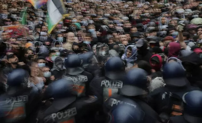 Police officers clash with protesters during a demonstration to commemorate the Nakba Day in Berlin, Germany, Thursday, May 15, 2025. (AP Photo/Ebrahim Noroozi)