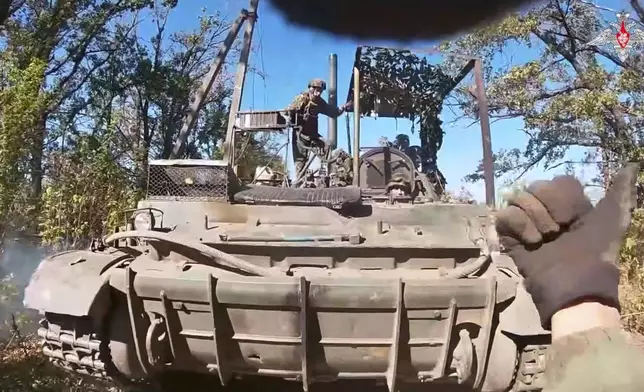 In this photo taken from video released by Russian Defense Ministry Press Service on Tuesday, May 6, 2025, a Russian 'Tyulpan' self-propelled heavy mortar takes a position to fire towards Ukrainian positions on an undisclosed location in Ukraine. (Russian Defense Ministry Press Service via AP)