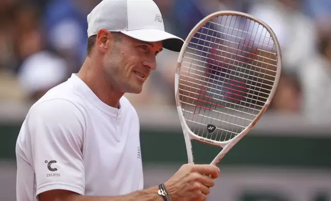 Tommy Paul of the U.S. reacts as he plays Denmark's Elmer Moller during their first round match of the French Tennis Open at the Roland Garros stadium, in Paris, Sunday May 25, 2025. (AP Photo/Lindsey Wasson)