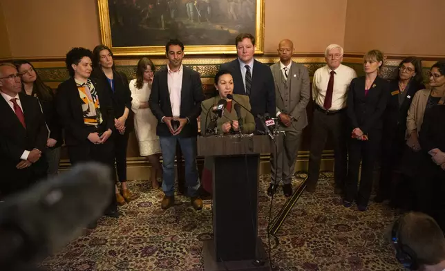 Vermont state Sen. Kesha Ram Hinsdale, D-Montpelier, center, speaks during a news conference announcing the launch of the Vermont Immigration Legal Defense Fund in the Cedar Creek Reception Room at the Vermont State House on Thursday, May 8, 2025, in Montpelier, Vt. (AP Photo/Alex Driehaus)