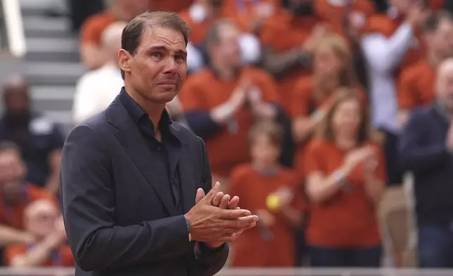 Rafa Nadal gets emotional during a farewell ceremony at center court Philippe-Chatrier, at the Roland-Garros stadium, in Paris, Sunday May 25, 2025. (AP Photo/Lindsey Wasson)