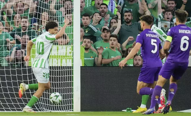 Betis' Abde Ezzalzouli celebrates after scoring during the Conference League semifinal first leg soccer match between Betis and Fiorentina at the Benito Villamarin stadium in Seville, Spain, Thursday, May 1, 2025. (AP Photo/Jose Breton)