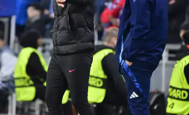 Chelsea's head coach Enzo Maresca, left, gestures during the Conference League semi-final first leg soccer match between Djurgardens IF and Chelsea FC in Stockholm, Sweden, Thursday, May 1, 2025. (Jonas Ekstroemer/TT News Agency via AP)