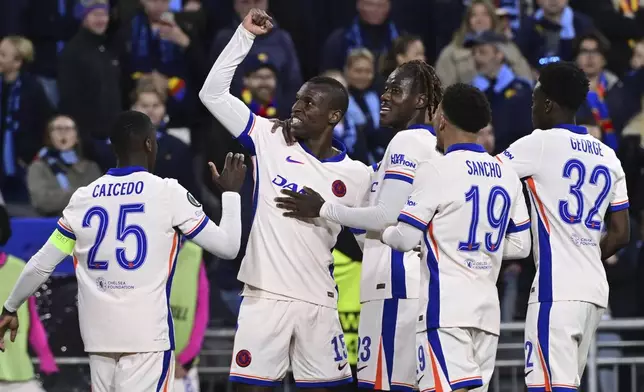 Chelsea's Nicolas Jackson, second left, celebrates after scoring his side's fourth goal during the Conference League semi-final first leg soccer match between Djurgardens IF and Chelsea FC in Stockholm, Sweden, Thursday, May 1, 2025. (Jonas Ekstroemer/TT News Agency via AP)