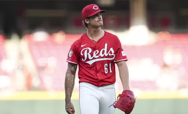 Cincinnati Reds pitcher Chase Petty walks to the dugout during the first inning of the second baseball game of a doubleheader against the St. Louis Cardinals, Wednesday, April 30, 2025, in Cincinnati. (AP Photo/Jeff Dean)