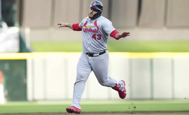 St. Louis Cardinals' Pedro Pagés gestures as he rounds the bases after hitting a solo home run during the second inning of the second baseball game of a doubleheader against the Cincinnati Reds Wednesday, April 30, 2025, in Cincinnati. (AP Photo/Jeff Dean)