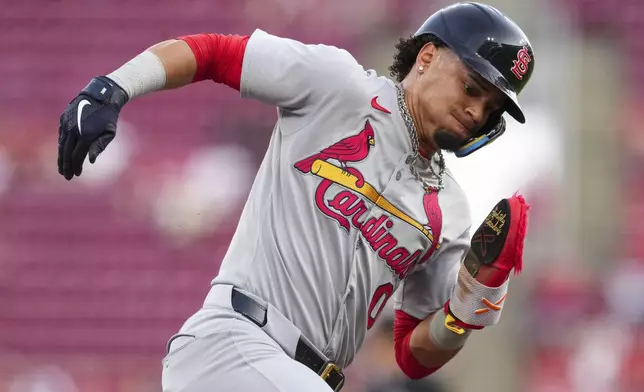 St. Louis Cardinals' Masyn Winn rounds third base and scores on a single hit by Brendan Donovan during the third inning of the second baseball game of a doubleheader against the Cincinnati Reds, Wednesday, April 30, 2025, in Cincinnati. (AP Photo/Jeff Dean)