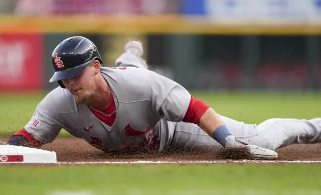 St. Louis Cardinals' Nolan Gorman reaches third base on a double hit by Jordan Walker during the third inning of the second baseball game of a doubleheader against the Cincinnati Reds Wednesday, April 30, 2025, in Cincinnati. (AP Photo/Jeff Dean)