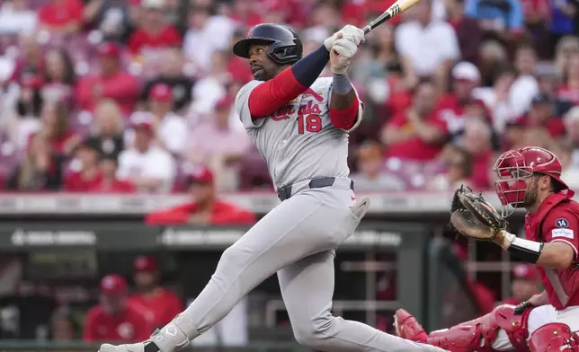 St. Louis Cardinals' Jordan Walker (18) watches his two-run double during the third inning of the second baseball game of a doubleheader against the Cincinnati Reds Wednesday, April 30, 2025, in Cincinnati. (AP Photo/Jeff Dean)