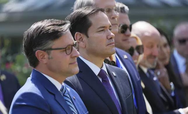 House Speaker Mike Johnson, R-La., from left, Secretary of State Marco Rubio, Treasury Secretary Scott Bessent, Defense Secretary Pete Hegseth, Attorney General Pam Bondi and Commerce Secretary Howard Lutnick listen as President Donald Trump speaks during a National Day of Prayer event in the Rose Garden of the White House, Thursday, May 1, 2025, in Washington. (AP Photo/Evan Vucci)