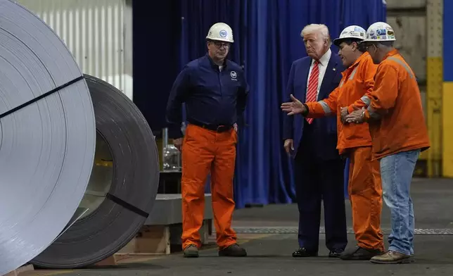 President Donald Trump talks to workers as he tours U.S. Steel Corporation's Mon Valley Works-Irvin plant, Friday, May 30, 2025, in West Mifflin, Pa. (AP Photo/Julia Demaree Nikhinson)