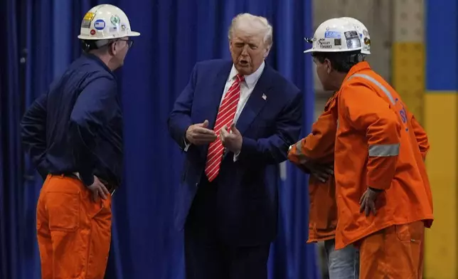 President Donald Trump talks to workers as he tours U.S. Steel Corporation's Mon Valley Works-Irvin plant, Friday, May 30, 2025, in West Mifflin, Pa. (AP Photo/Julia Demaree Nikhinson)