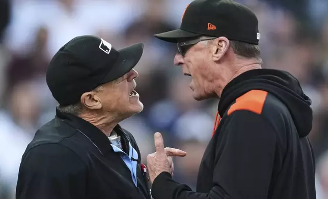 San Francisco Giants manager Bob Melvin, right, argues with home plate umpire Tony Randazzo, left, after being ejected in the fifth inning during a baseball game against the Detroit Tigers, Tuesday, May 27, 2025, in Detroit. (AP Photo/Paul Sancya)