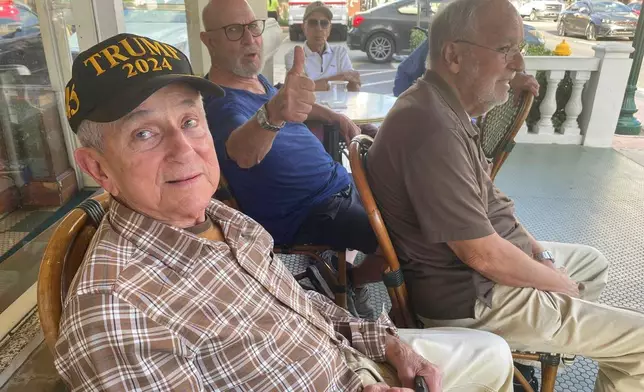 In this undated photo MAGA fans hang out at Café Versailles in Little Havana, Miami, Fla. (AP Photo/Josh Goodman)
