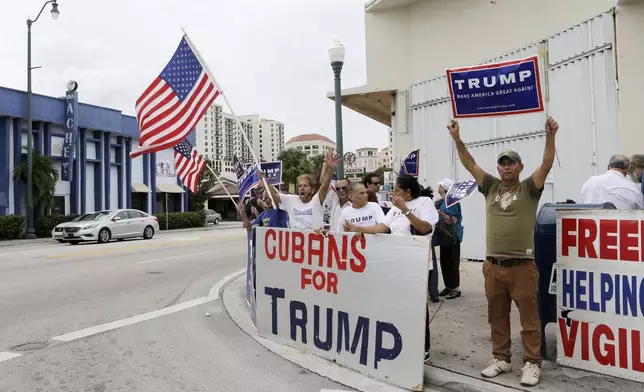 FILE - Cuban-Americans chant pro-Trump slogans as they show their support for Republican presidential candidate Donald Trump in Miami on Oct. 28, 2016. (AP Photo/Alan Diaz, File)