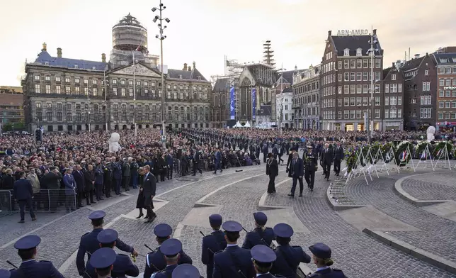 Dutch King Willem-Alexander and Queen Maxima, left, leave after laying a wreath during a solemn annual national service to commemorate the war dead in Amsterdam, Netherlands, Sunday, May 4, 2025. (AP Photo/Peter Dejong)