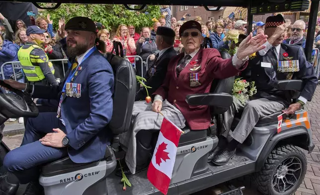 Canadian World War II veterans take part in a parade to mark Liberation Day in Wageningen, Netherlands, Monday, May 5, 2025. (AP Photo/Peter Dejong)