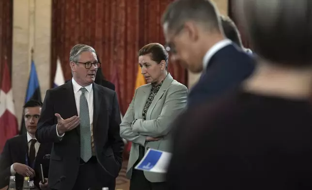 Britain's Prime Minister Keir Starmer talks to Danish Prime Minister Mette Frederiksen during the Joint Expeditionary Force (JEF) Leaders' Summit in Oslo, Friday, May 9, 2025.(AP Photo/Alastair Grant, Pool)