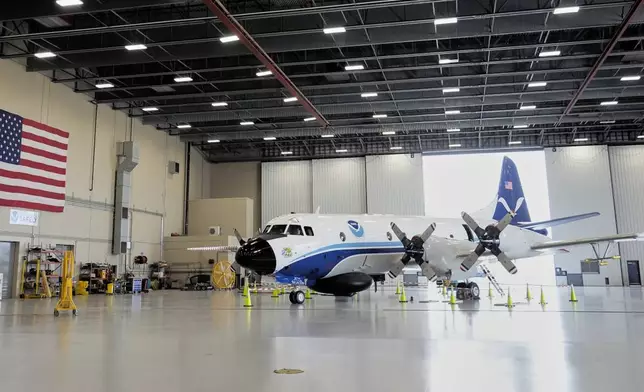 The Lockheed WP-3D Orion "Hurricane Hunter" aircraft is seen in a hangar at the NOAA Aircraft Operations Center Tuesday, May 6, 2025, in Lakeland, Fla. (AP Photo/John Raoux)