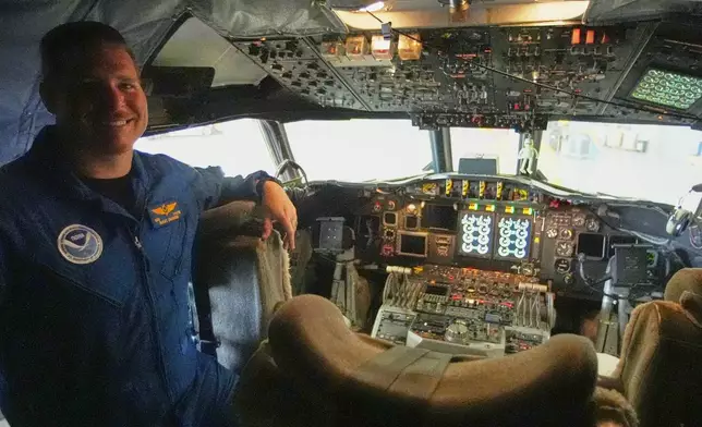 NOAA Flight Engineer Dan Tyson in the cockpit of the Lockheed WP-3D Orion 'Hurricane Hunter' aircraft at the NOAA Aircraft Operations Center Tuesday, May 6, 2025, in Lakeland, Fla. (AP Photo/John Raoux)