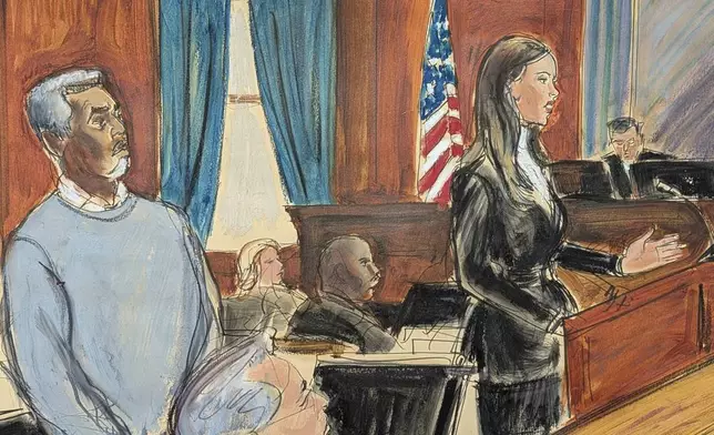 Sean Diddy Combs, left, stands as his defense attorney, Teny Geragos, gives her opening statement to the jury on the first day of trial in Manhattan federal court, Monday, May 12, 2025, in New York. (Elizabeth Williams via AP)