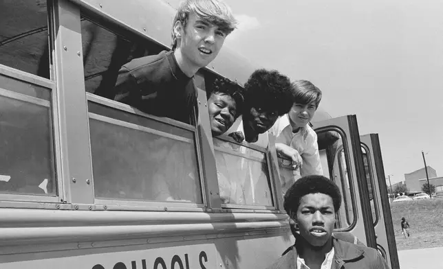 FILE - Students from Charlotte High School in Charlotte, N.C., ride a bus together, May 15, 1972. (AP Photo/Harold L. Valentine, File)