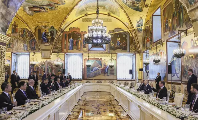 Russian President Vladimir Putin, third right, and Russian Security Council Deputy Chairman and the head of the United Russia party Dmitry Medvedev, attend a working lunch with China President Xi Jinping, fourth left, at The Faceted Chamber of the Kremlin's Grand Palace at the Kremlin in Moscow, Russia, Thursday, May 8, 2025, ahead of celebrations of the 80th anniversary of the Soviet Union's victory over Nazi Germany during the World War II. (Mikhail Metzel, Sputnik, Kremlin Pool Photo via AP)