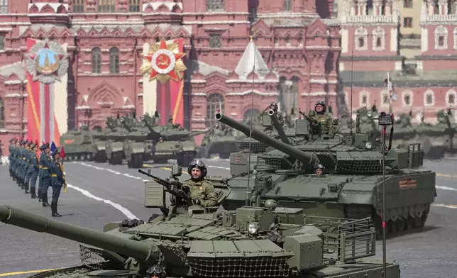 Russian T-80 BVM tanks roll in Red square during the Victory Day military parade in Moscow, Russia, Friday, May 9, 2025, during celebrations of the 80th anniversary of the Soviet Union's victory over Nazi Germany during the World War II. (AP Photo/Alexander Zemlianichenko)