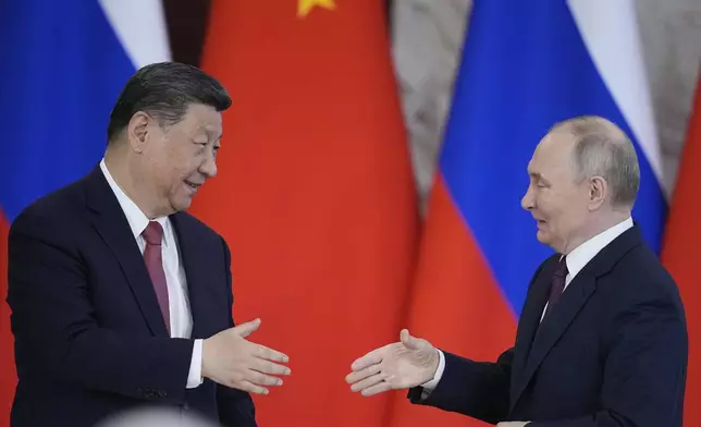Russian President Vladimir Putin, right, and Chinese President Xi Jinpin attend a signing ceremony after their meeting at the Kremlin in Moscow, Russia, Thursday, May 8, 2025, ahead of celebrations of the 80th anniversary of the Soviet Union's victory over Nazi Germany during the World War II. (AP Photo/Pavel Bednyakov)