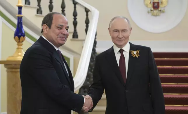 Russian President Vladimir Putin greets Egyptian President Abdel Fattah el-Sissi, left, ahead of the Victory Day military parade in Moscow, Russia, Friday, May 9, 2025, marking the 80th anniversary of the Soviet Union's victory over Nazi Germany during the World War II. (Alexey Nikolsky/Photo host agency RIA Novosti via AP)