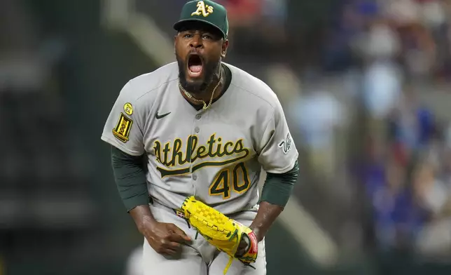 Oakland Athletics starting pitcher Luis Severino reacts after striking out Texas Rangers' Jake Burger with the bases loaded to end the third inning of a baseball game Wednesday, April 30, 2025, in Arlington, TX. (AP Photo/Julio Cortez)