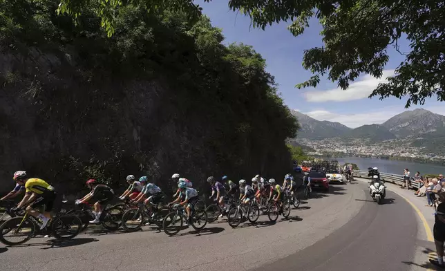 The pack rides during the 18th stage of the Giro d'Italia from Morbegno to Cesano Maderno, Italy, Thursday May 29, 2025. (Fabio Ferrari/LaPresse via AP)