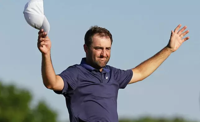 Scottie Scheffler celebrates after winning the PGA Championship golf tournament at the Quail Hollow Club, Sunday, May 18, 2025, in Charlotte, N.C. (AP Photo/George Walker IV)