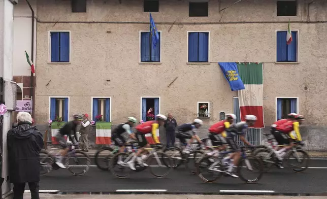 The pack rides during the 14th stage of the Giro d'Italia cycling race from Treviso to Nova Gorica/Gorizia, Italy, Saturday, May 24, 2025. (Marco Alpozzi/LaPresse via AP)