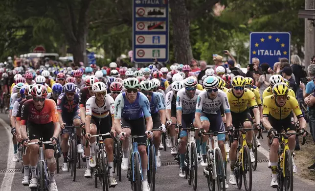 The pack rides during the 14th stage of the Giro d'Italia cycling race from Treviso to Nova Gorica/Gorizia, Italy, Saturday, May 24, 2025. (Marco Alpozzi/LaPresse via AP)