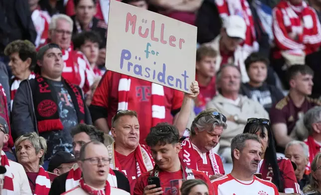 Bayern Munich fan holds placard reading "Muller for President" ahead of the German Bundesliga soccer match between FC Bayern Munich and Borussia Moenchengladbach in Munich, Germany, Saturday, May 10, 2025. (AP Photo/Matthias Schrader)