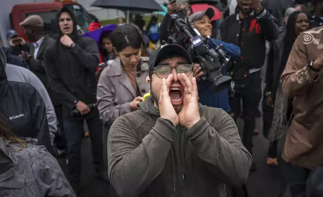 FILE - A protestor shouts, "Let him out", demanding the release of Newark Mayor Ras Baraka after his arrest while protesting at an ICE detention prison, in Newark, N.J., May 9, 2025, (AP Photo/Angelina Katsanis, File)