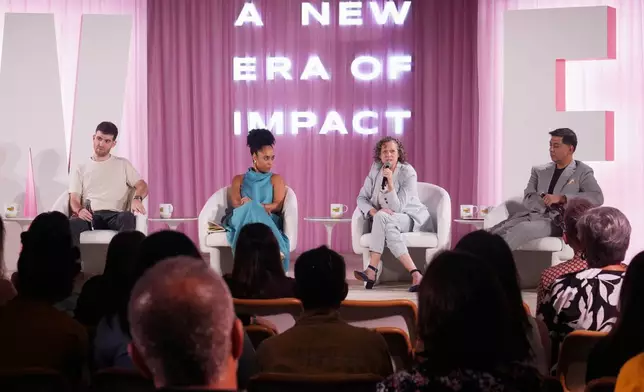 Abigail Disney, second right, speaks during The Elevate Prize Foundation's Make Good Famous Summit, Tuesday, May 13, 2025, in Miami Beach, Fla. (AP Photo/Marta Lavandier)