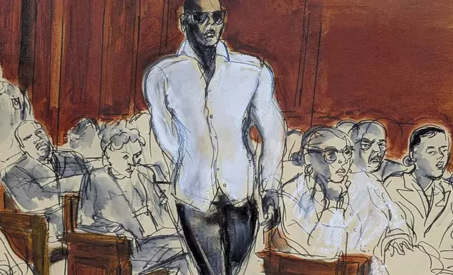 Witness Daniel Philip walks into the courtroom in Manhattan federal court, Tuesday, May 13, 2025, in New York. (Elizabeth Williams via AP)