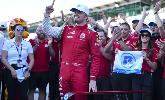 Robert Shwartzman, of Israel, celebrates after winning the pole position during qualifications for the Indianapolis 500 auto race at Indianapolis Motor Speedway in Indianapolis, Sunday, May 18, 2025. (AP Photo/Michael Conroy)
