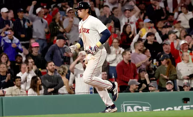 Boston Red Sox's Triston Casas runs to the plate after hitting a three-run homerun during the eighth inning of a baseball game against the Seattle Mariners, Wednesday, April 23, 2025, in Boston. (AP Photo/Mark Stockwell)